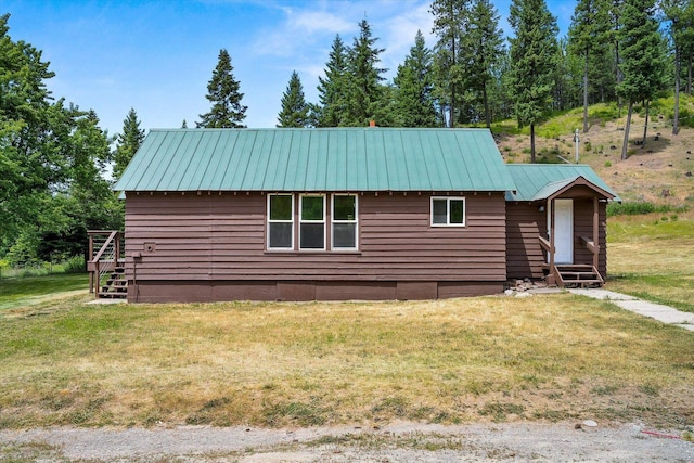 1541 Thompson Rd, Elk, WA 99009 - view of home's exterior with a lawn, a metal roof, and entry steps