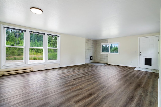 1541 Thompson Rd, Elk, WA 99009 - unfurnished living room featuring wood finished floors and a baseboard radiator
