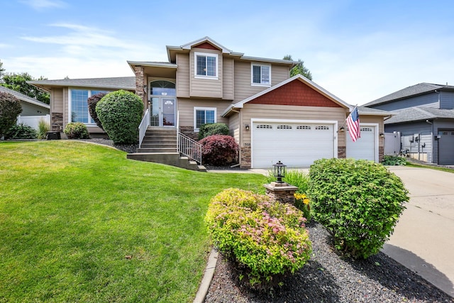 1308 S Drummond Rd, Spokane Valley, WA 99016 - tri-level home with an attached garage, a front yard, and concrete driveway
