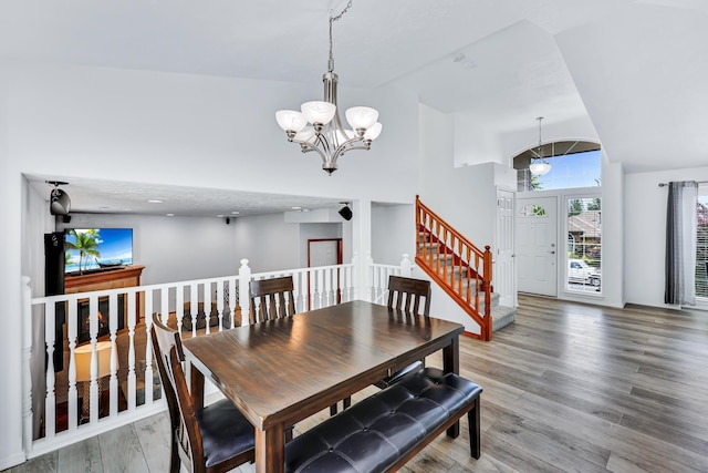 1308 S Drummond Rd, Spokane Valley, WA 99016 - dining area featuring a chandelier, a high ceiling, and wood finished floors