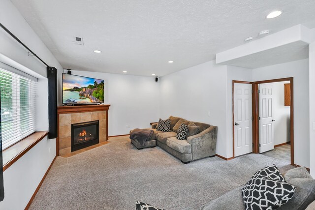 1308 S Drummond Rd, Spokane Valley, WA 99016 - living area with carpet flooring, a tile fireplace, and recessed lighting