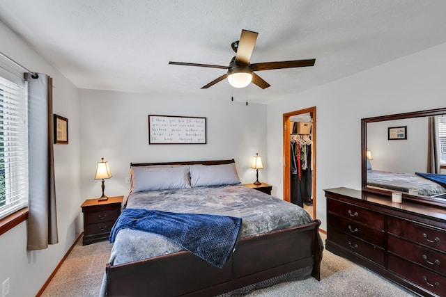 1308 S Drummond Rd, Spokane Valley, WA 99016 - bedroom with light colored carpet, a spacious closet, a ceiling fan, and a closet