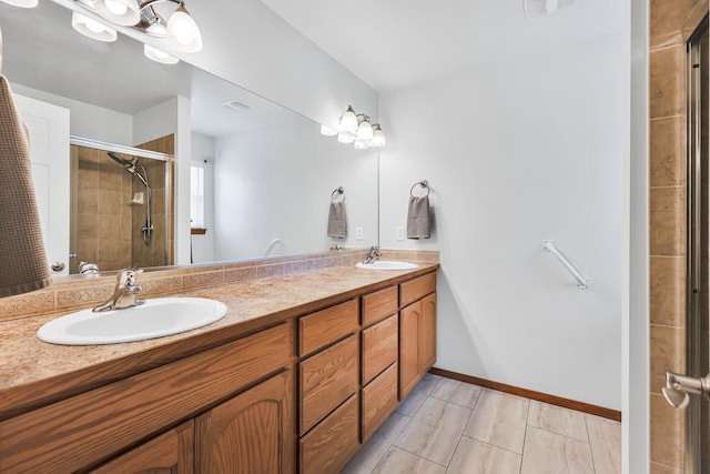 1308 S Drummond Rd, Spokane Valley, WA 99016 - bathroom featuring double vanity and tiled shower