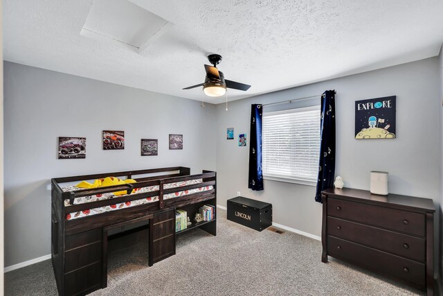1308 S Drummond Rd, Spokane Valley, WA 99016 - bedroom with a textured ceiling, carpet flooring, attic access, and a ceiling fan