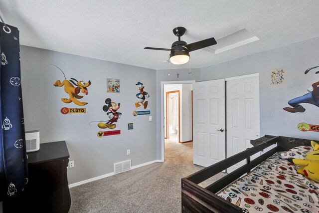 1308 S Drummond Rd, Spokane Valley, WA 99016 - carpeted bedroom featuring a textured ceiling, a ceiling fan, a skylight, and a closet