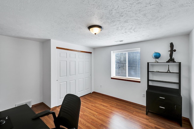 1308 S Drummond Rd, Spokane Valley, WA 99016 - office featuring wood finished floors and a textured ceiling