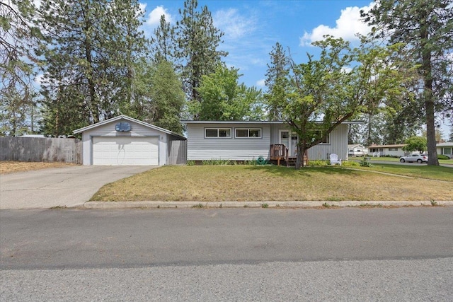 6503 N Calispel St, Spokane, WA 99208 - view of front of house with a garage and an outbuilding