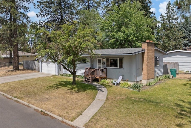 6503 N Calispel St, Spokane, WA 99208 - ranch-style house with a chimney, concrete driveway, and a garage