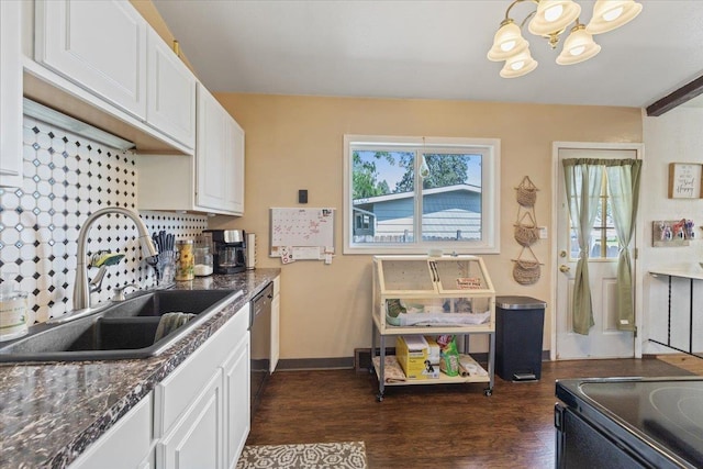 6503 N Calispel St, Spokane, WA 99208 - kitchen featuring a chandelier, white cabinets, dark wood-style flooring, and dark countertops