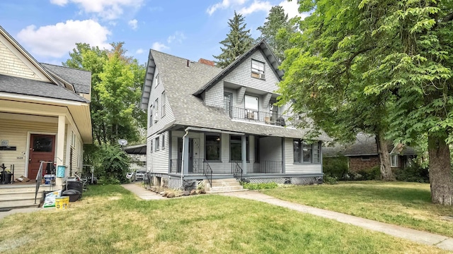 1622 W 10th Ave, Spokane, WA 99204 - view of front of property with covered porch, a balcony, a front yard, roof with shingles, and a chimney
