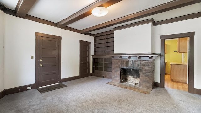 1622 W 10th Ave, Spokane, WA 99204 - unfurnished living room featuring carpet, beamed ceiling, and a fireplace