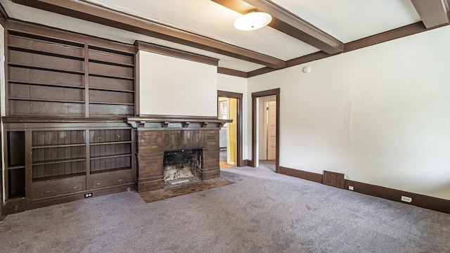 1622 W 10th Ave, Spokane, WA 99204 - unfurnished living room with carpet floors, beamed ceiling, and a brick fireplace