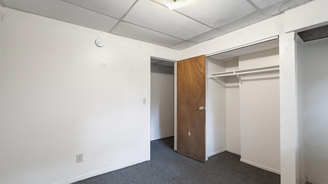 1622 W 10th Ave, Spokane, WA 99204 - unfurnished bedroom featuring dark carpet, a paneled ceiling, and a closet