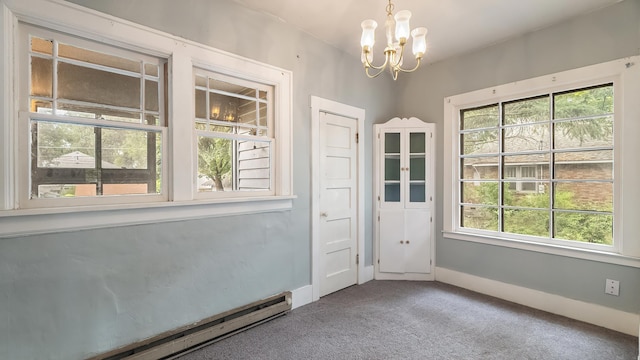 1622 W 10th Ave, Spokane, WA 99204 - unfurnished room featuring a baseboard heating unit, a chandelier, and carpet flooring