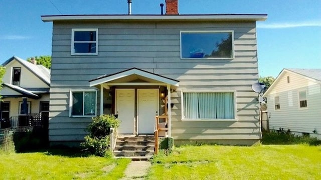 2526 W Sinto Ave, Spokane, WA 99201 - rear view of house with a chimney and a yard