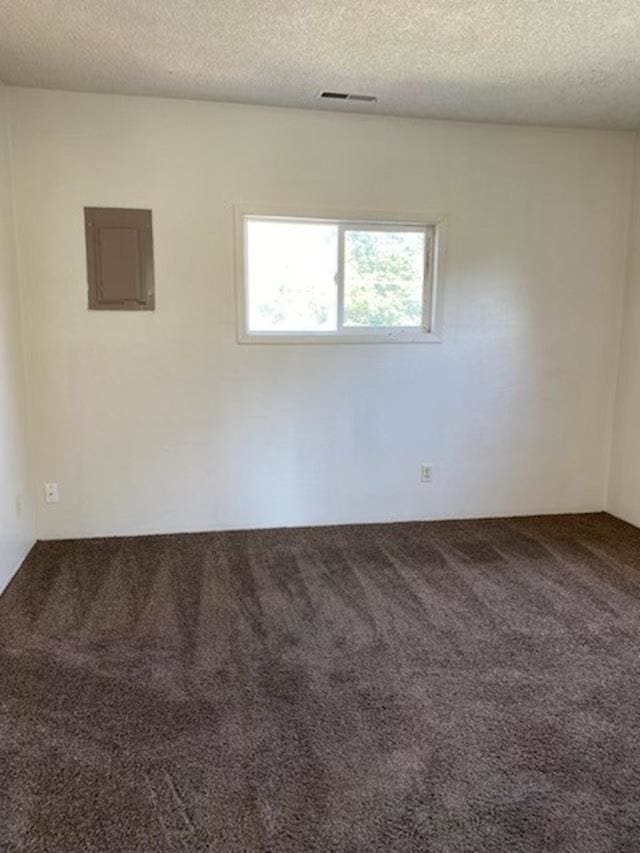 2526 W Sinto Ave, Spokane, WA 99201 - carpeted empty room featuring electric panel and a textured ceiling