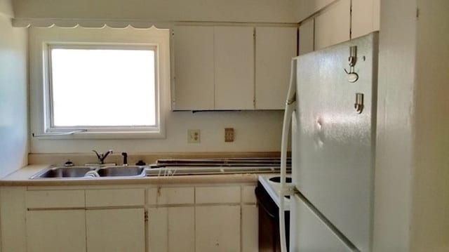 2526 W Sinto Ave, Spokane, WA 99201 - kitchen with freestanding refrigerator, range with electric stovetop, and light countertops
