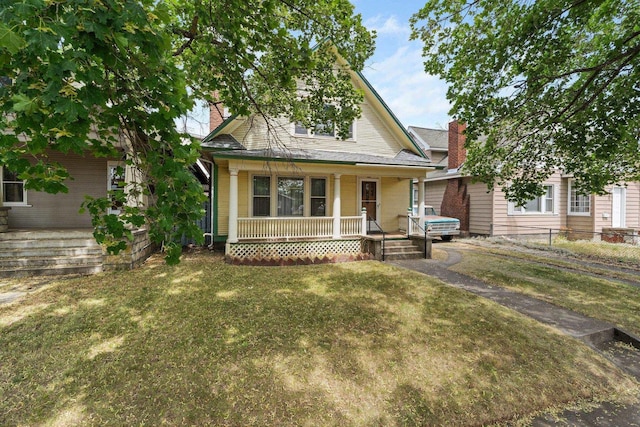 2624 W College Ave, Spokane, WA 99201 - view of front facade with a porch and a chimney