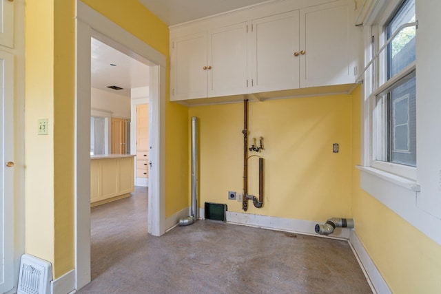 2624 W College Ave, Spokane, WA 99201 - laundry area featuring cabinet space and washer hookup