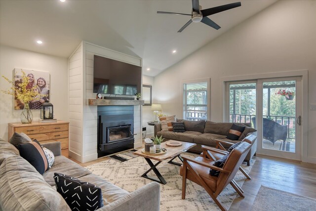33348 Lakeview Ln, Valley, WA 99181 - living area with a ceiling fan, recessed lighting, wood finished floors, a large fireplace, and high vaulted ceiling