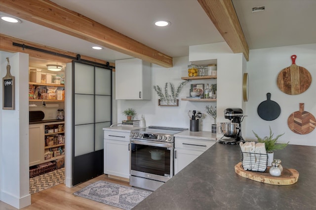 33348 Lakeview Ln, Valley, WA 99181 - kitchen featuring stainless steel range with electric stovetop, a barn door, beamed ceiling, white cabinets, and recessed lighting