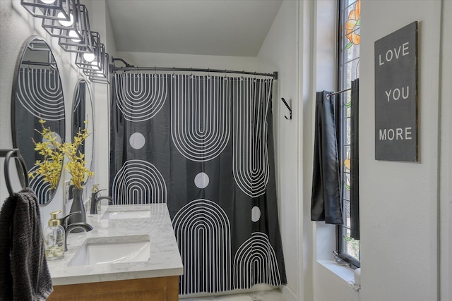 33348 Lakeview Ln, Valley, WA 99181 - bathroom featuring double vanity, marble look tiles, and a shower with shower curtain