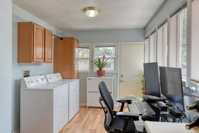 4526 N Walnut St, Spokane, WA 99205 - washroom featuring cabinet space, washer and clothes dryer, light wood-type flooring, a textured ceiling, and a desk