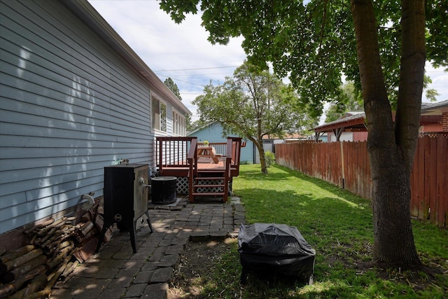 4526 N Walnut St, Spokane, WA 99205 - view of yard featuring a wooden deck and a patio