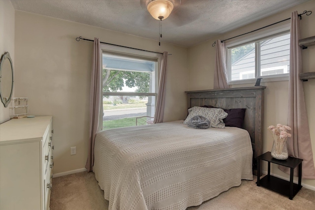4526 N Walnut St, Spokane, WA 99205 - bedroom with light carpet and a textured ceiling