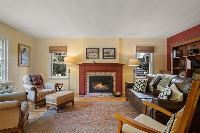 203 W 21st Ave, Spokane, WA 99203 - living room with plenty of natural light, a brick fireplace, and wood finished floors