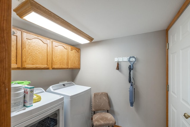 7106 S Moran View St, Spokane, WA 99224 - laundry area with cabinet space and washer and dryer