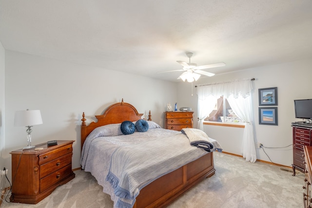7106 S Moran View St, Spokane, WA 99224 - bedroom with light carpet and a ceiling fan