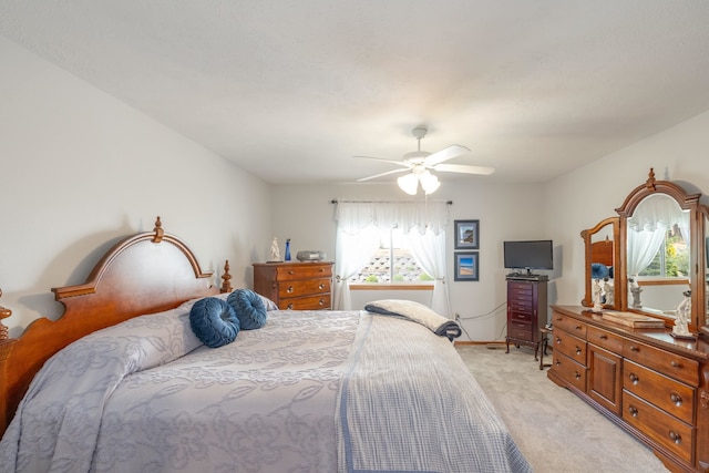 7106 S Moran View St, Spokane, WA 99224 - bedroom with light colored carpet and a ceiling fan