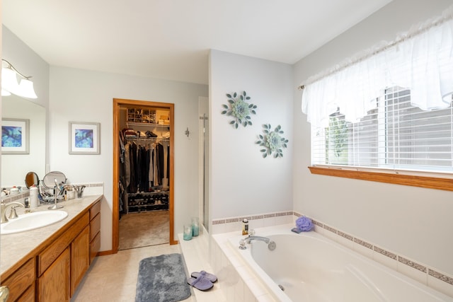 7106 S Moran View St, Spokane, WA 99224 - bathroom featuring vanity, a bath, tile patterned floors, and a spacious closet