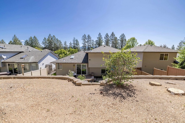 7106 S Moran View St, Spokane, WA 99224 - back of property with a patio and a shingled roof