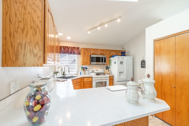 7106 S Moran View St, Spokane, WA 99224 - kitchen featuring white appliances, a peninsula, and light countertops