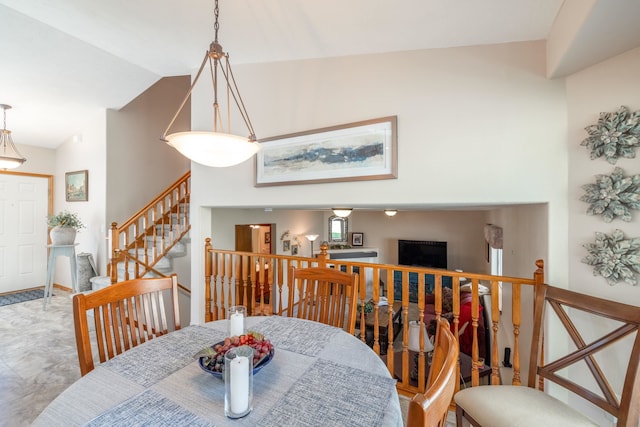 7106 S Moran View St, Spokane, WA 99224 - dining area with lofted ceiling and stairs