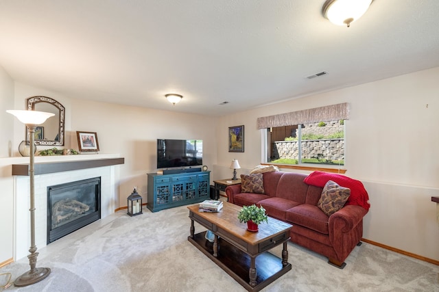 7106 S Moran View St, Spokane, WA 99224 - carpeted living room with a glass covered fireplace and baseboards