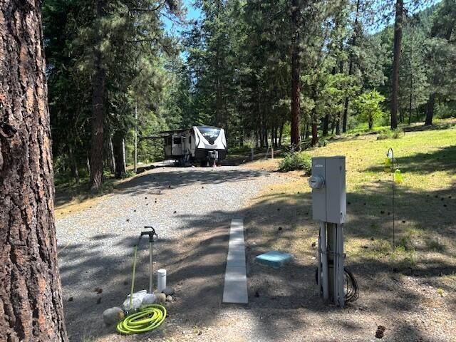 1599 Coyote Way, Evans, WA 99126 - exterior view of electric meter and a forest