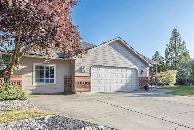 5622 E Sheffield, Colbert, WA 99005 - single story home featuring brick siding, a garage, and concrete driveway