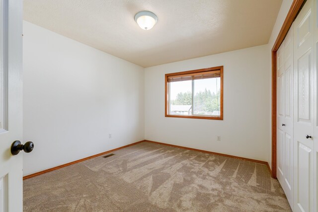 5622 E Sheffield, Colbert, WA 99005 - unfurnished bedroom with a closet and carpet flooring