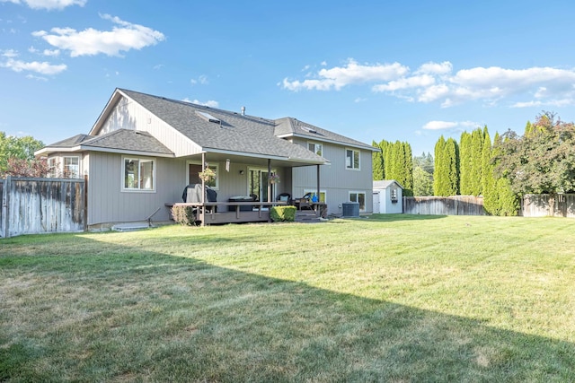 5622 E Sheffield, Colbert, WA 99005 - back of house featuring a storage unit, a fenced backyard, a deck, and a shingled roof