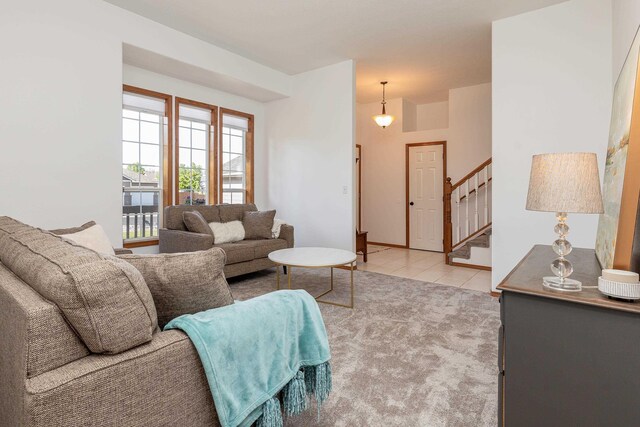 5622 E Sheffield, Colbert, WA 99005 - living area featuring stairs, light tile patterned floors, and light carpet