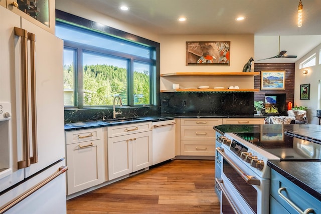 210 3rd St, Dover, ID 83825 - kitchen featuring white appliances, open shelves, recessed lighting, wood finished floors, and tasteful backsplash