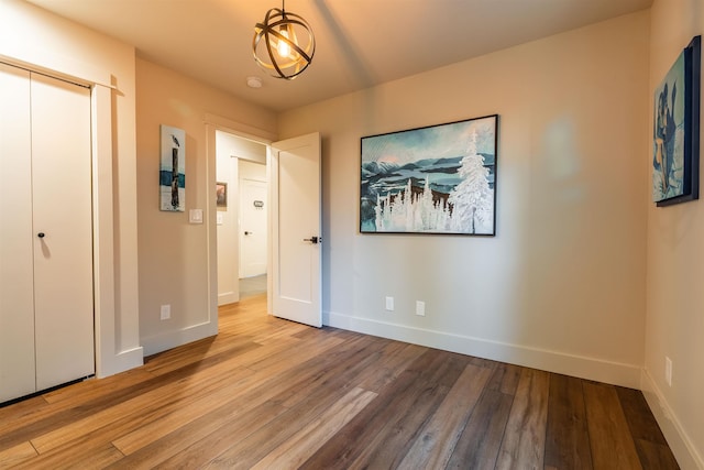 210 3rd St, Dover, ID 83825 - unfurnished bedroom with wood finished floors and a closet