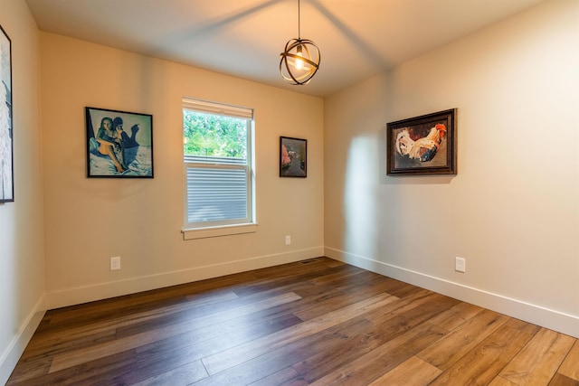 210 3rd St, Dover, ID 83825 - empty room featuring hardwood / wood-style floors and baseboards