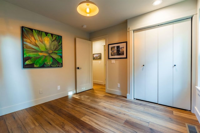 210 3rd St, Dover, ID 83825 - unfurnished bedroom with light wood-type flooring and a closet