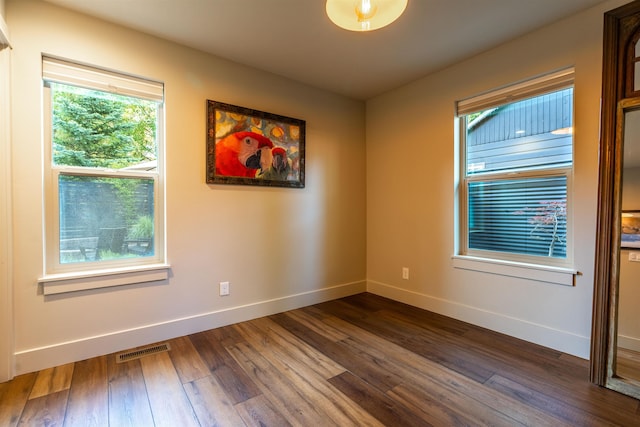 210 3rd St, Dover, ID 83825 - spare room featuring baseboards and dark wood-type flooring