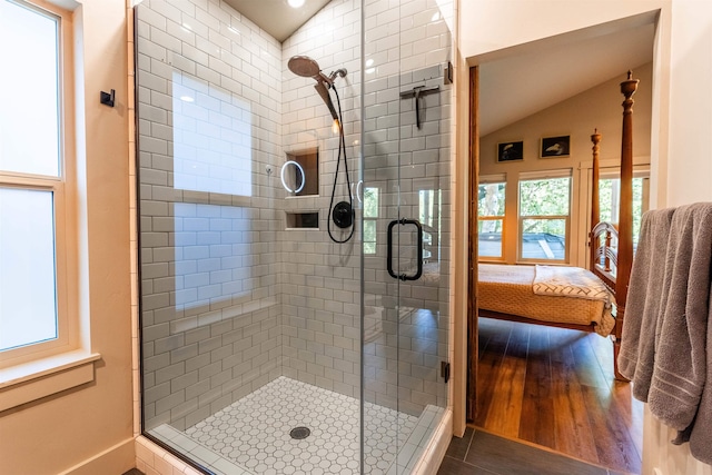210 3rd St, Dover, ID 83825 - bathroom featuring a shower stall, ensuite bathroom, lofted ceiling, and wood finished floors