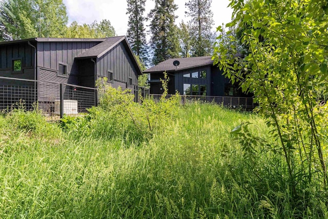 210 3rd St, Dover, ID 83825 - view of side of property featuring board and batten siding